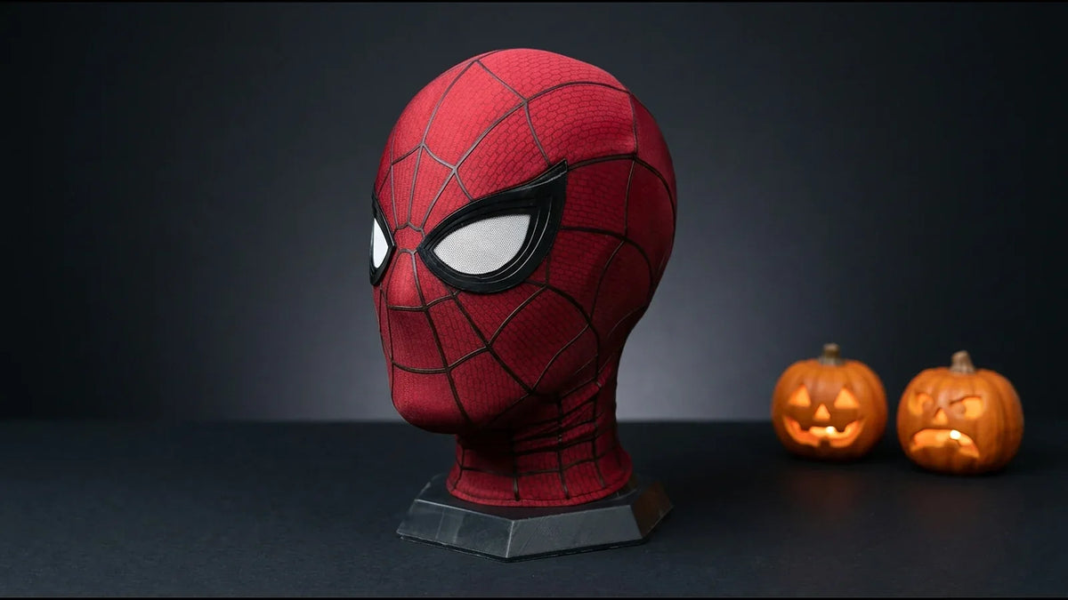 Spider-Man Brand New Day mask on a dark background with glowing Halloween pumpkins behind it