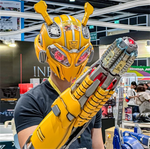 Man wearing the Bumblebee helmet and arm cannon together, barrel extended