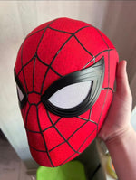 Spider-Man Brand New Day mask held in one hand, lens mesh visible up close
