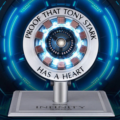 Iron Man Arc Reactor with the blue core lit and Proof That Tony Stark Has A Heart engraved on the ring