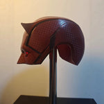 Side view of the red Daredevil Born Again mask on a display stand