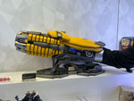 Bumblebee arm blaster worn with the hand closed into the cannon shape