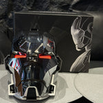 Black chrome Iron Man MK17 helmet beside its printed retail box