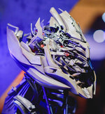Megatron helmet displayed in a room under coloured lighting