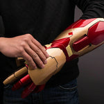 Man fitting the 1:1 Iron Man MK42 gauntlet onto his forearm